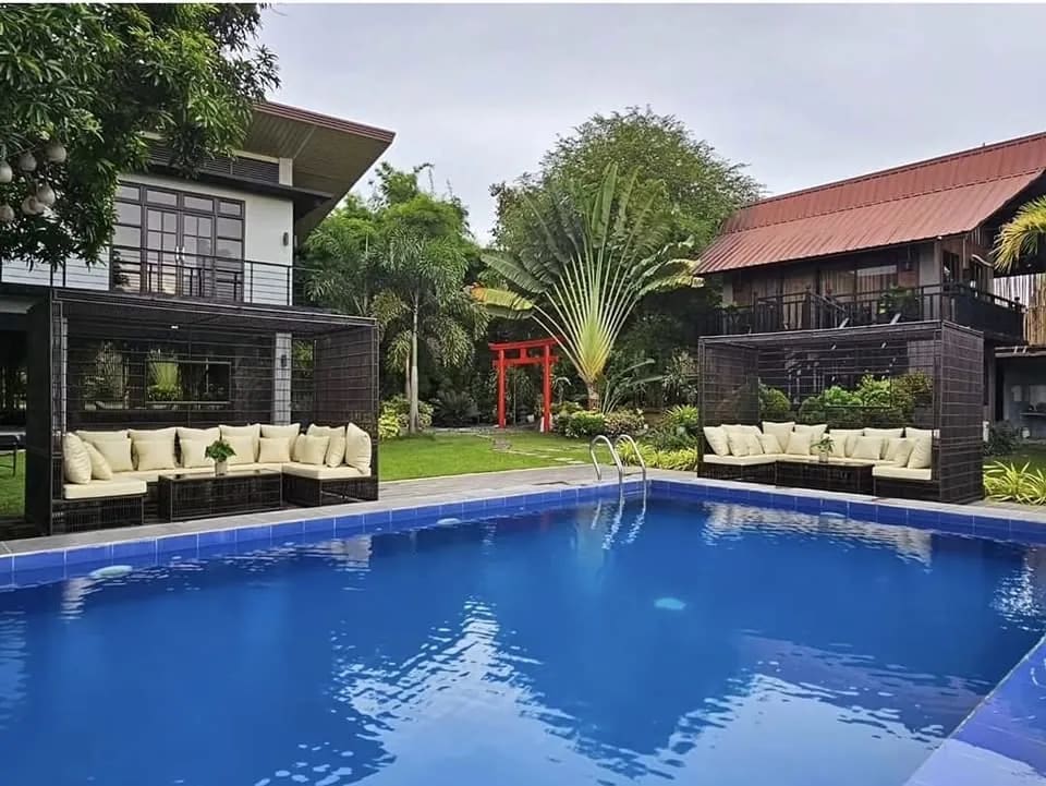 Nokori Private Resort pool, garden, and guest villas